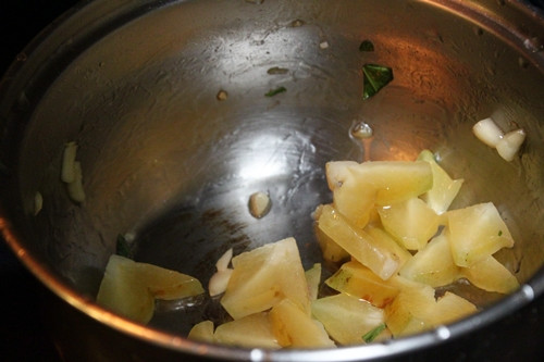 Sautéing starfruit for Tangy Shrimp and Starfruit Stew - 4