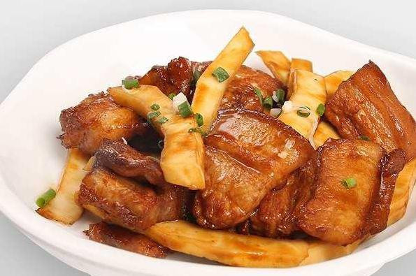 Finished bowl of Vietnamese Caramelized Pork and Coconut (Thit Kho Dua), showing tender pork and coconut in caramel sauce