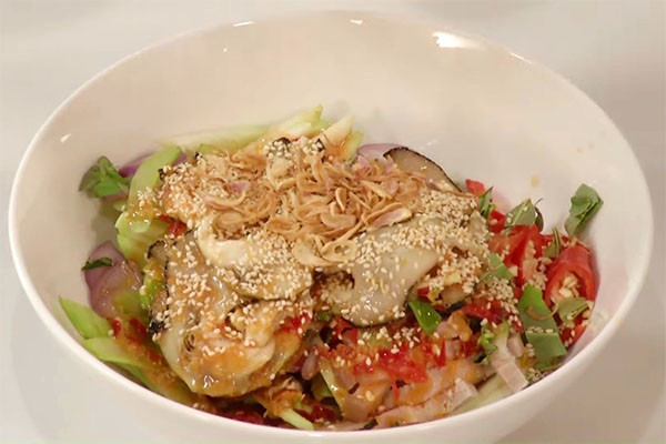 Mixing the squid salad