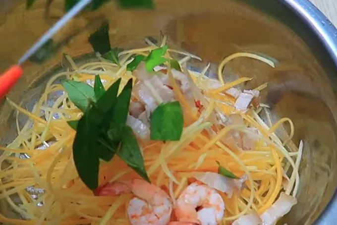 Mixing Banana Blossom Salad with Shrimp and Pork