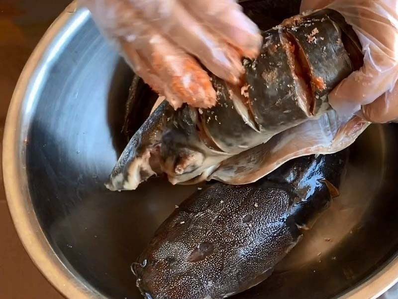 Marinating the catfish before frying