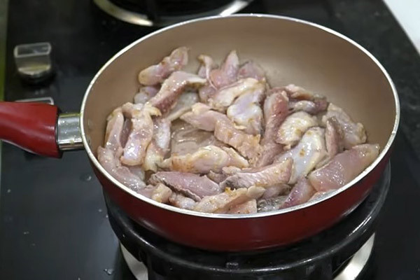 Sautéing the fish until lightly cooked