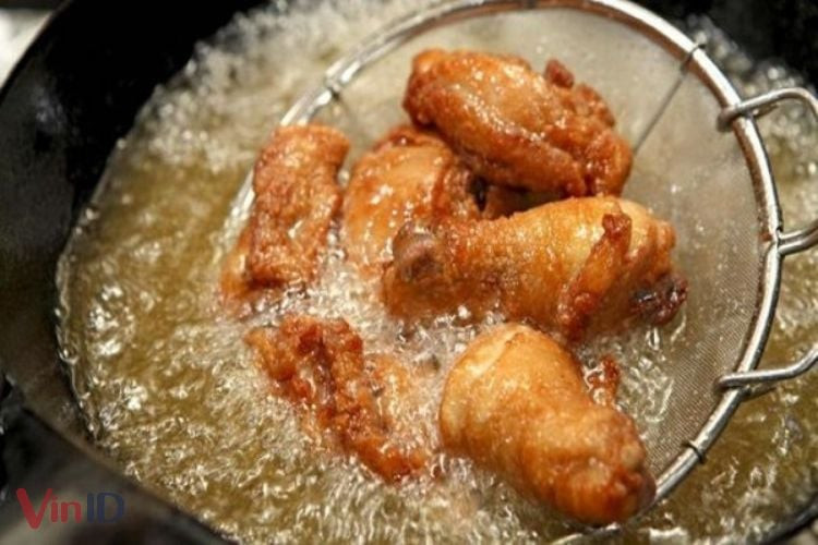Frying chicken in deep oil