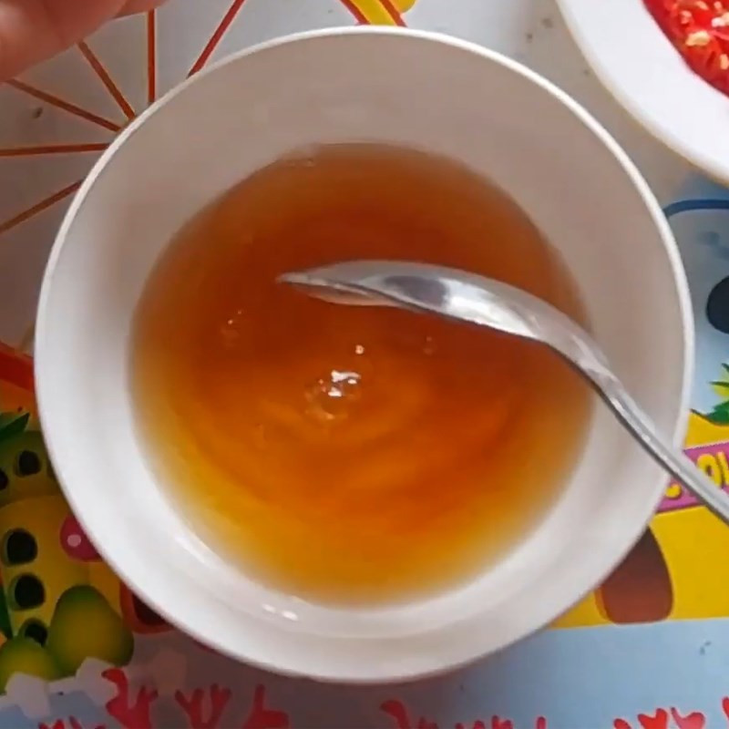 Mixing fish sauce for the fish dish