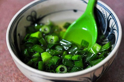 Preparing ingredients for grilled oysters with scallion oil