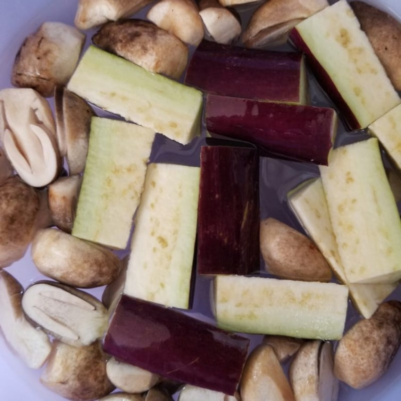 Shredded carrots, cucumber, and onion being prepared
