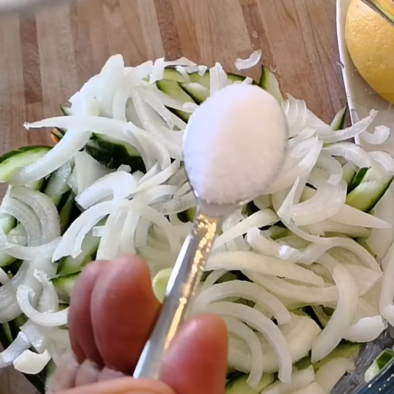 Mixing shredded vegetables with lime juice, salt, and sugar