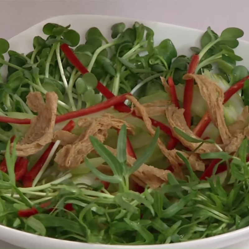 Mixing vegan sprout salad