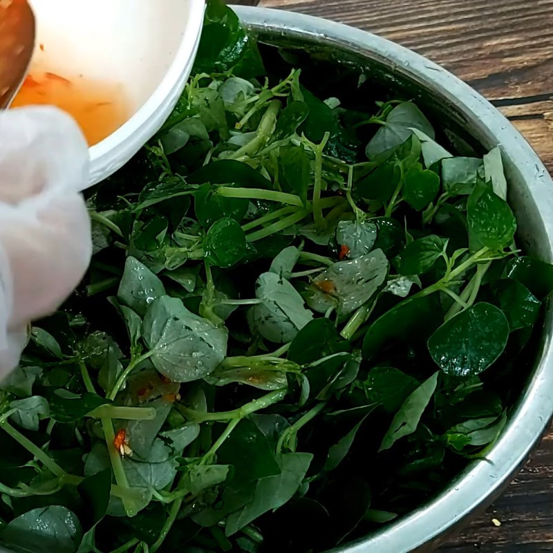 Mixing vegetarian watercress salad
